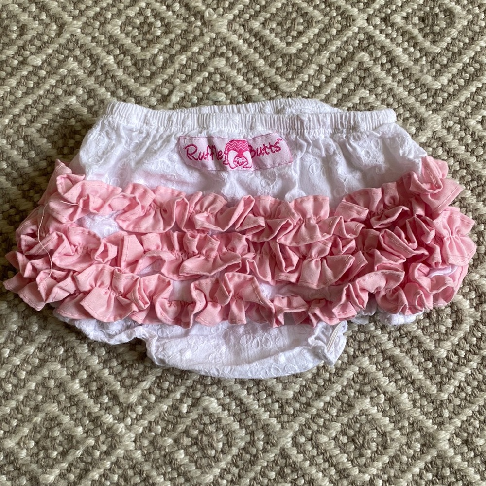 Ruffle Butts white eyelet style bloomers with light pink ruffles